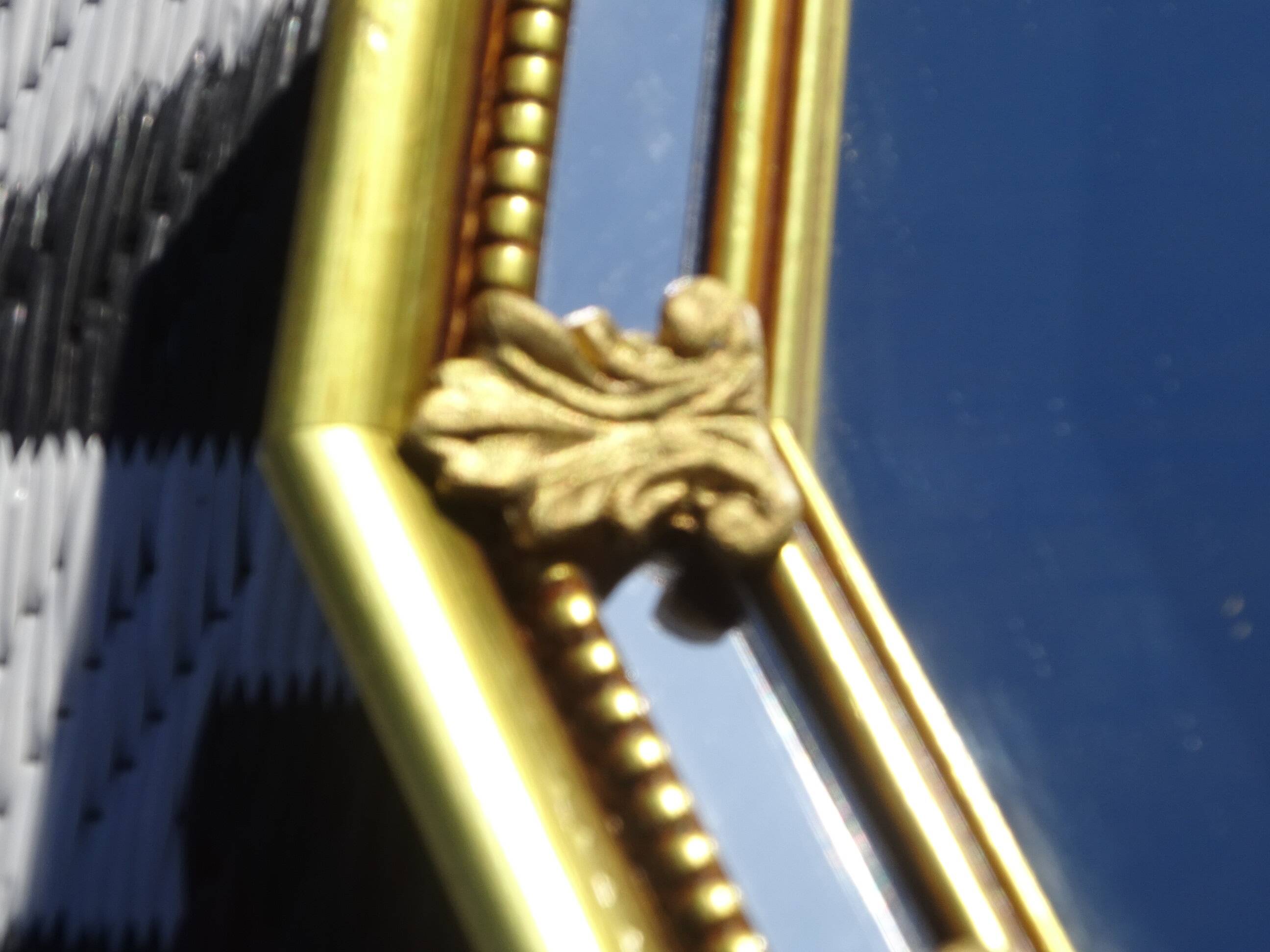 Hall mirror, gilded frame with fillets and fleur-de-lis.