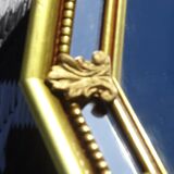 Hall mirror, gilded frame with fillets and fleur-de-lis.