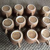 Series of 11 sandstone cups