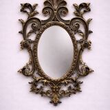 Antique Louis XV style mirror, richly carved with scrollwork, shells, and foliage.