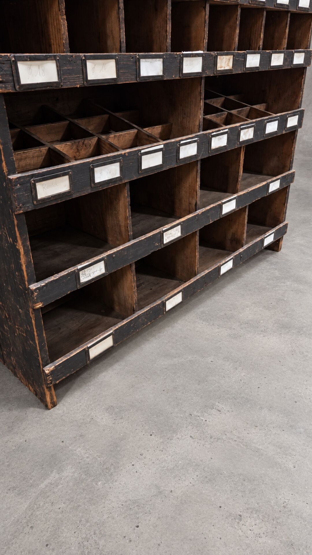 Antique workshop furniture in solid fir with numerous compartments.