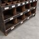 Antique workshop furniture in solid fir with numerous compartments.