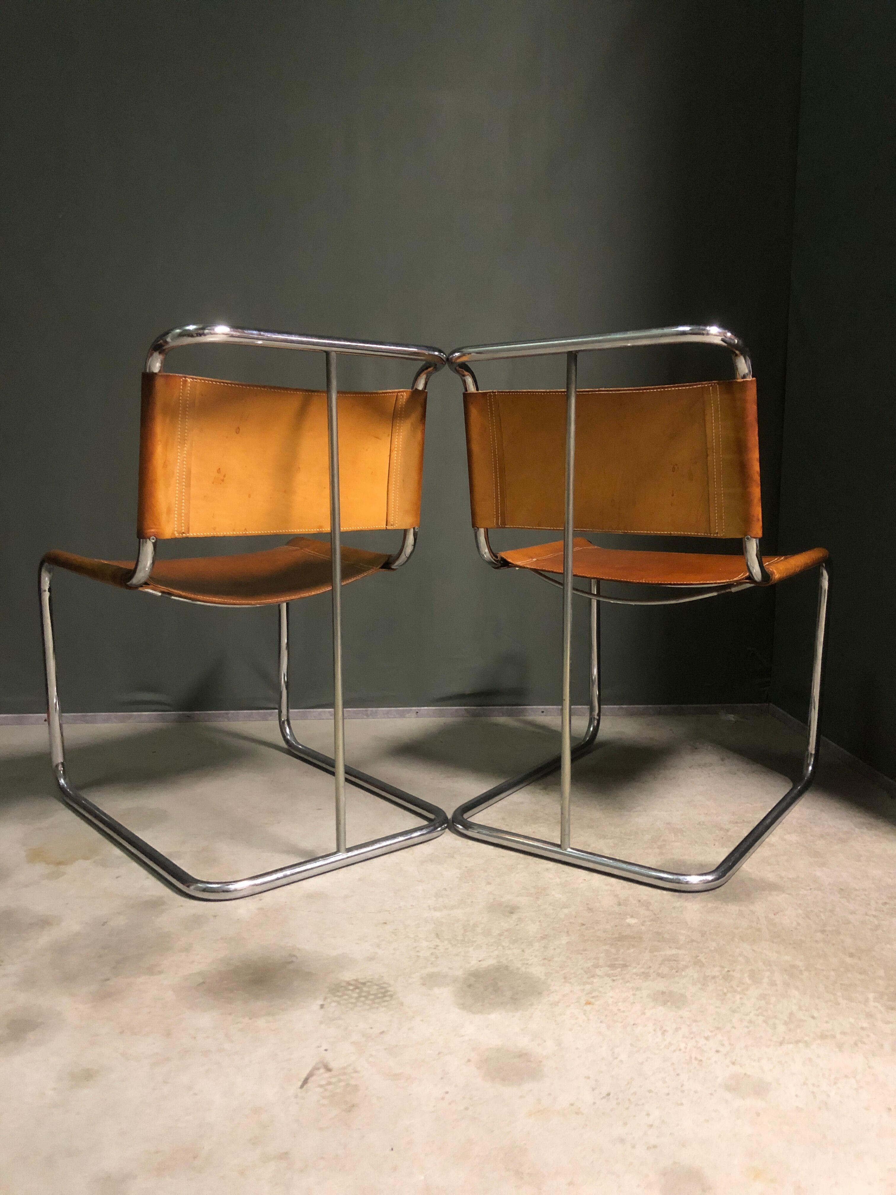 A pair of chromed tubular dining chairs 1980's