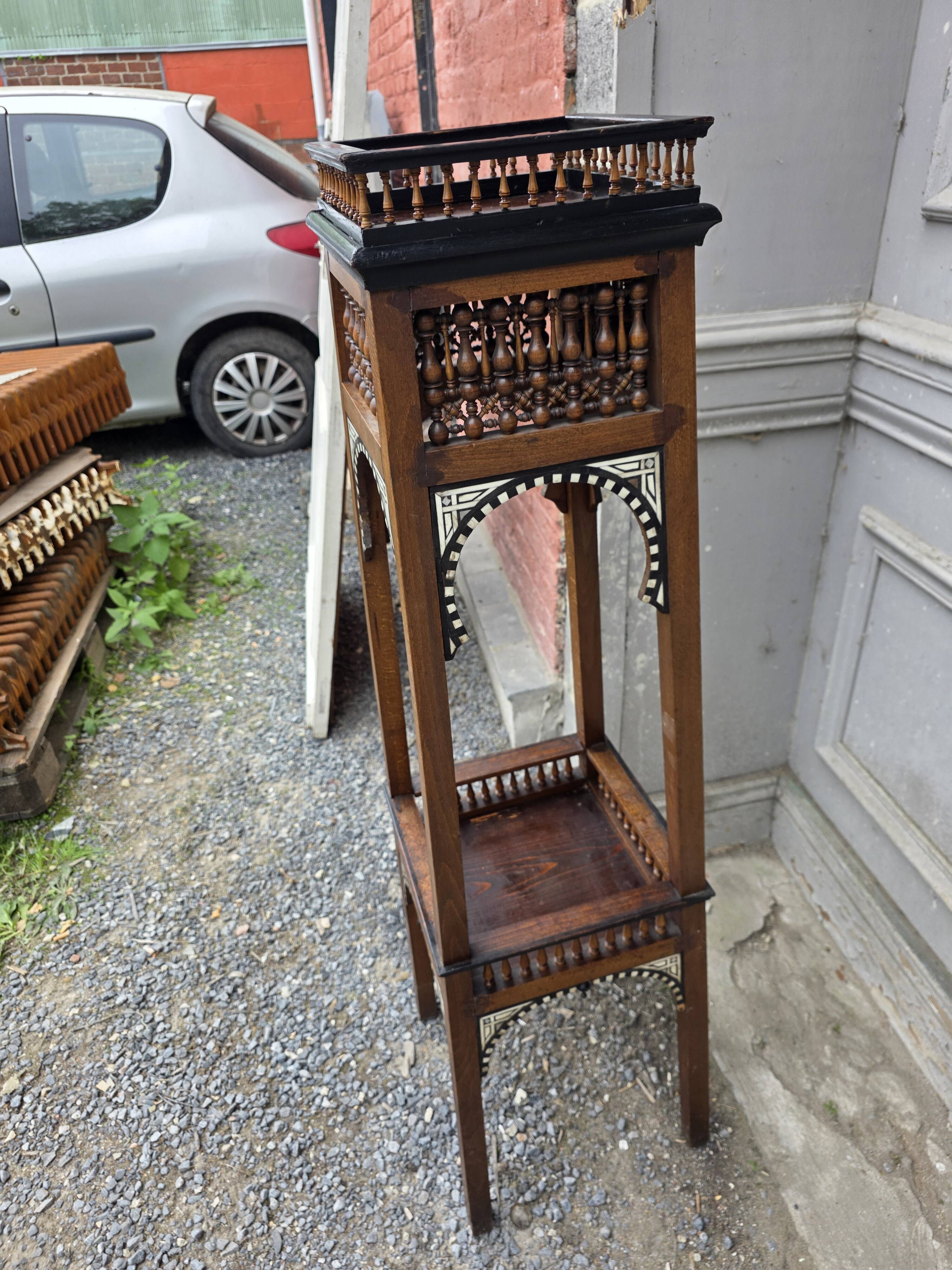 Antique pedestal from the early 20th century.