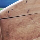 Oval table of grape harvesters from the Southwest in cherry wood