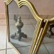 Gold wrought iron andiron and log holder for fireplace with grate