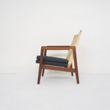 Rattan and leather low-back lounge chair by P.J. Muntendam for Gebr. Jonkers, The Netherlands 1950's
