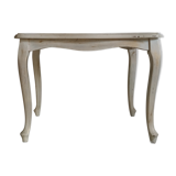 Old patinated coffee table and curved feet