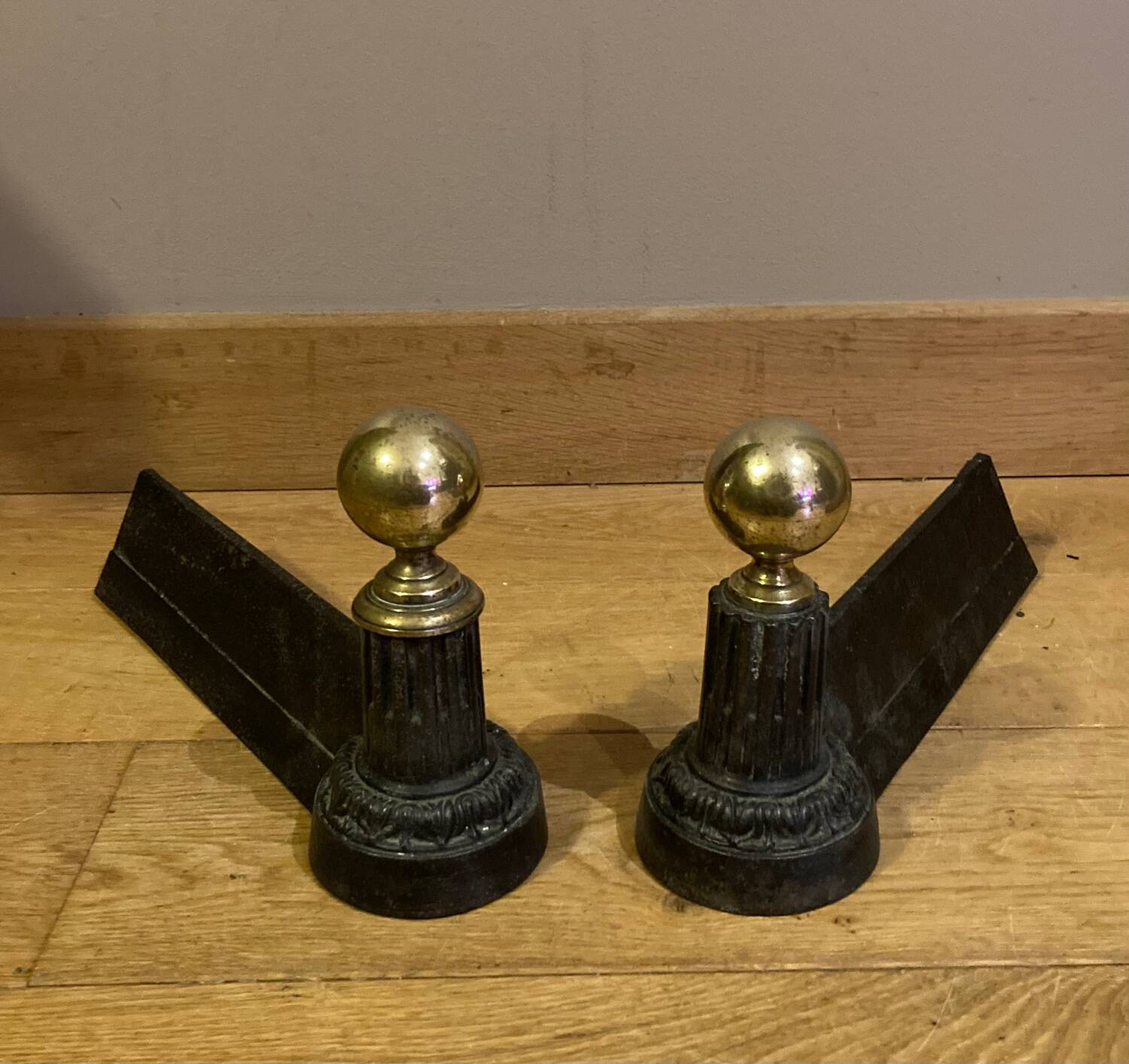 Pair of Napoleon III andirons from the 19th century in cast iron and brass