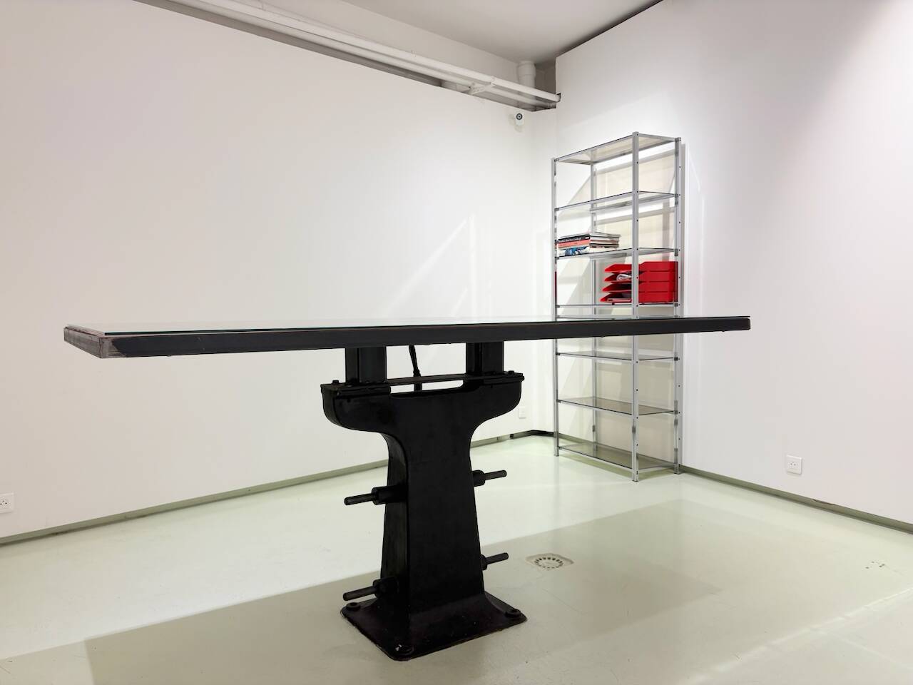 Industrial table with cast iron legs.