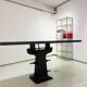 Industrial table with cast iron legs.