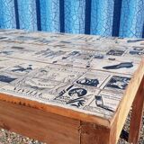 Teak dining table with illustrated top