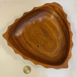 Carved wooden pocket emptier