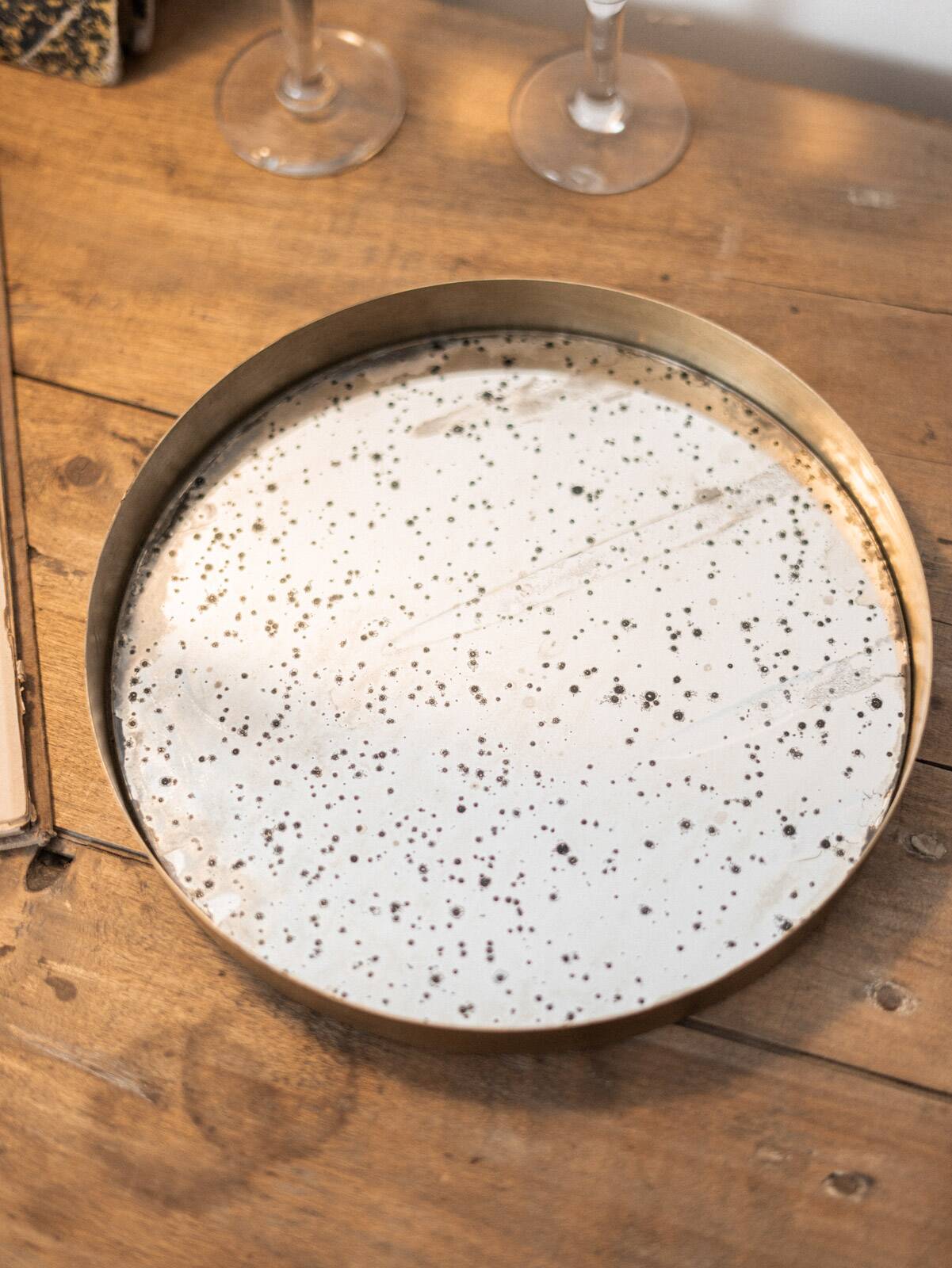 Patinated mirrored top and brass