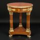 Circular gueridon empire of the 19th century in marquetry ornamented with gilt bronze