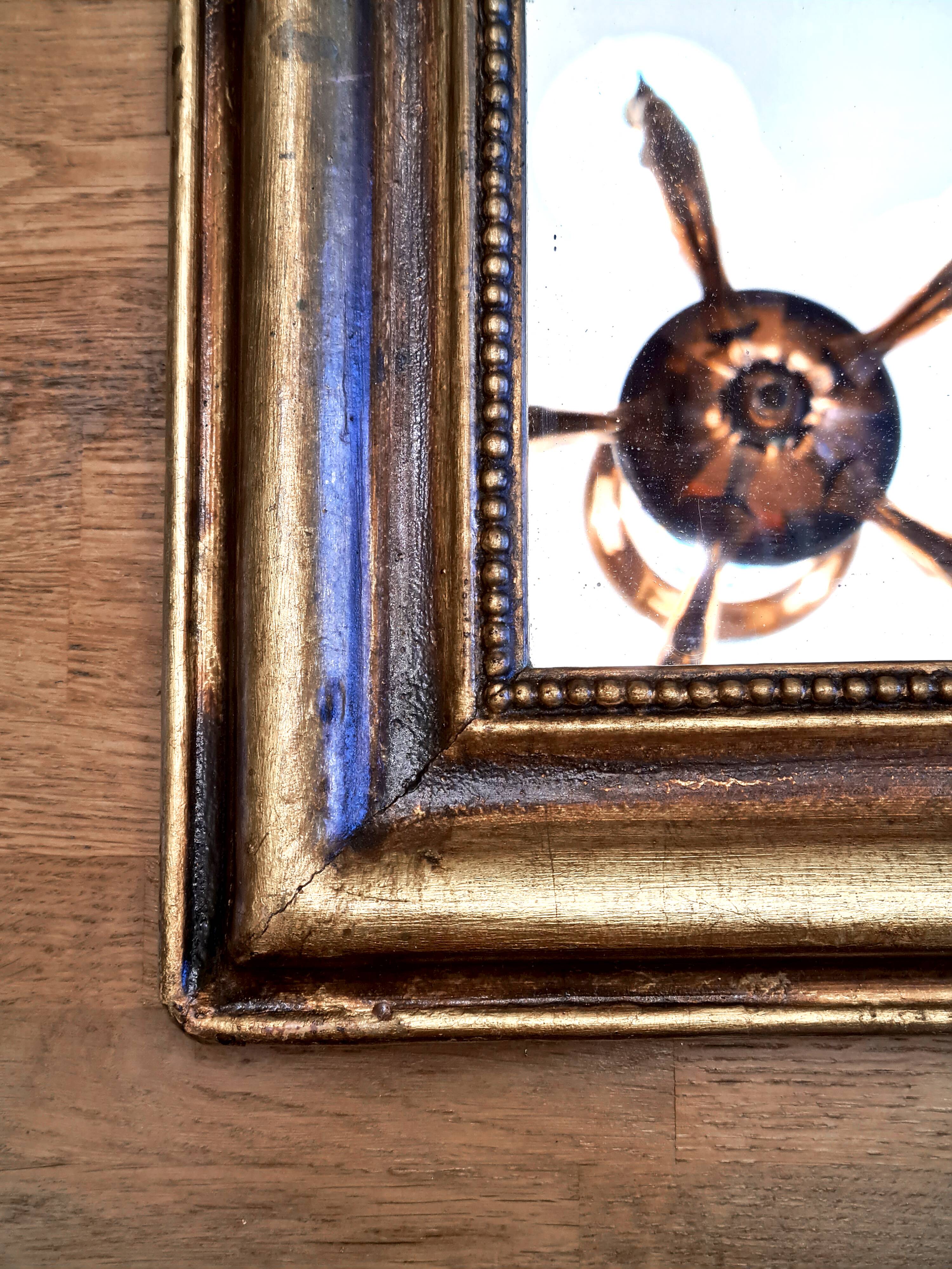 Antique Louis-Philippe gilded mirror “Apoline”