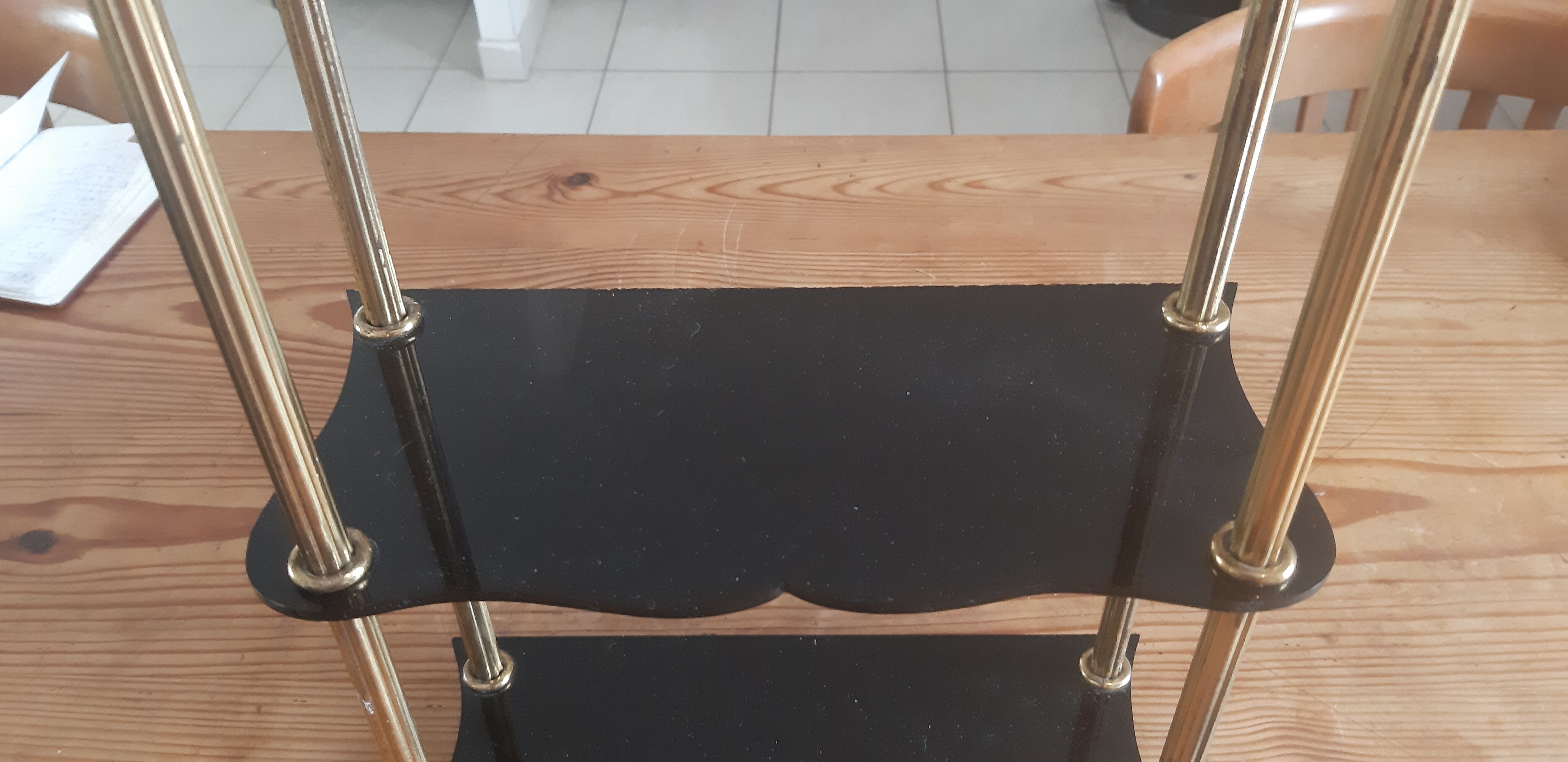 Vintage shelf of the 60s in golden metal and black plastic