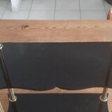 Vintage shelf of the 60s in golden metal and black plastic