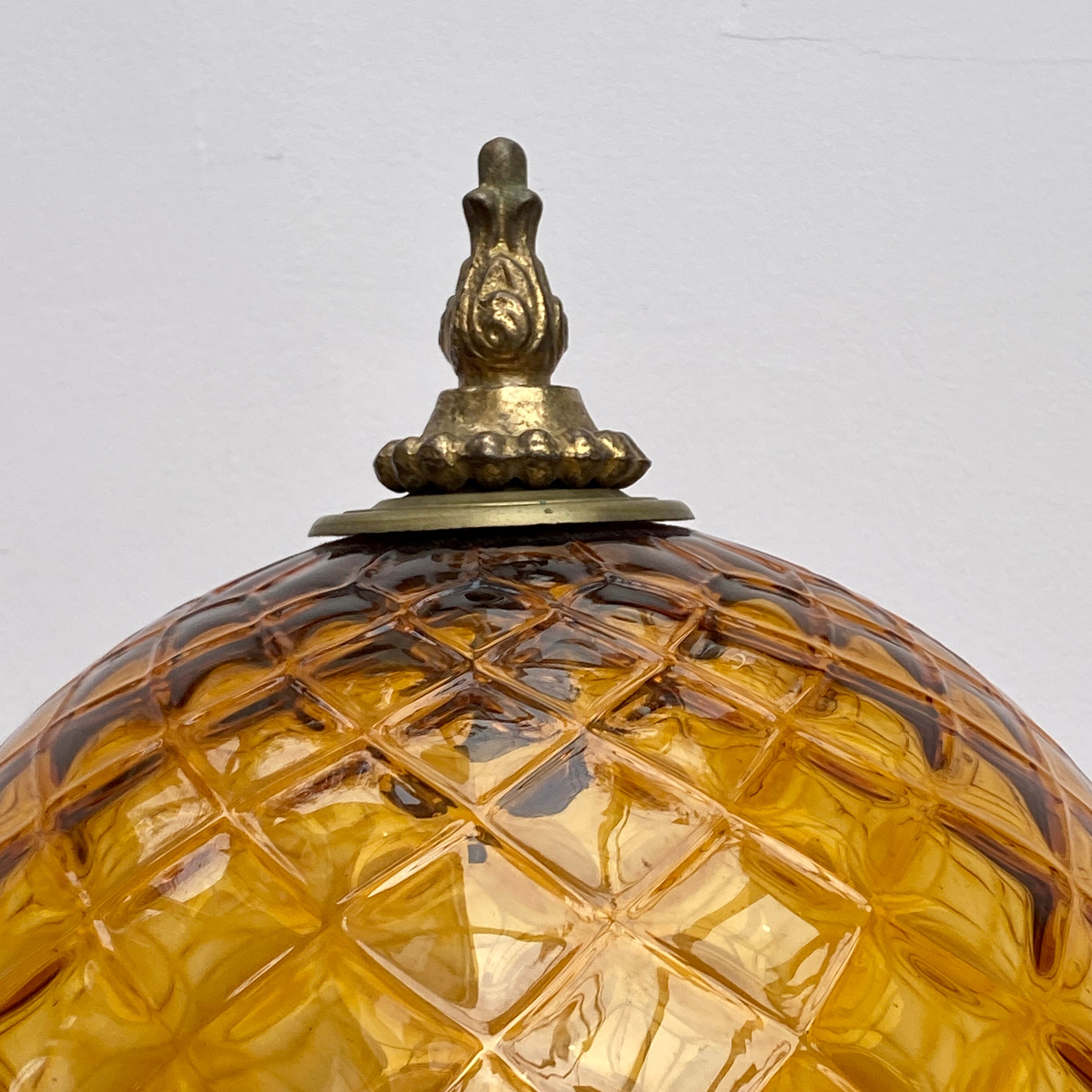 Vintage amber glass globe laying lamp with brass detail