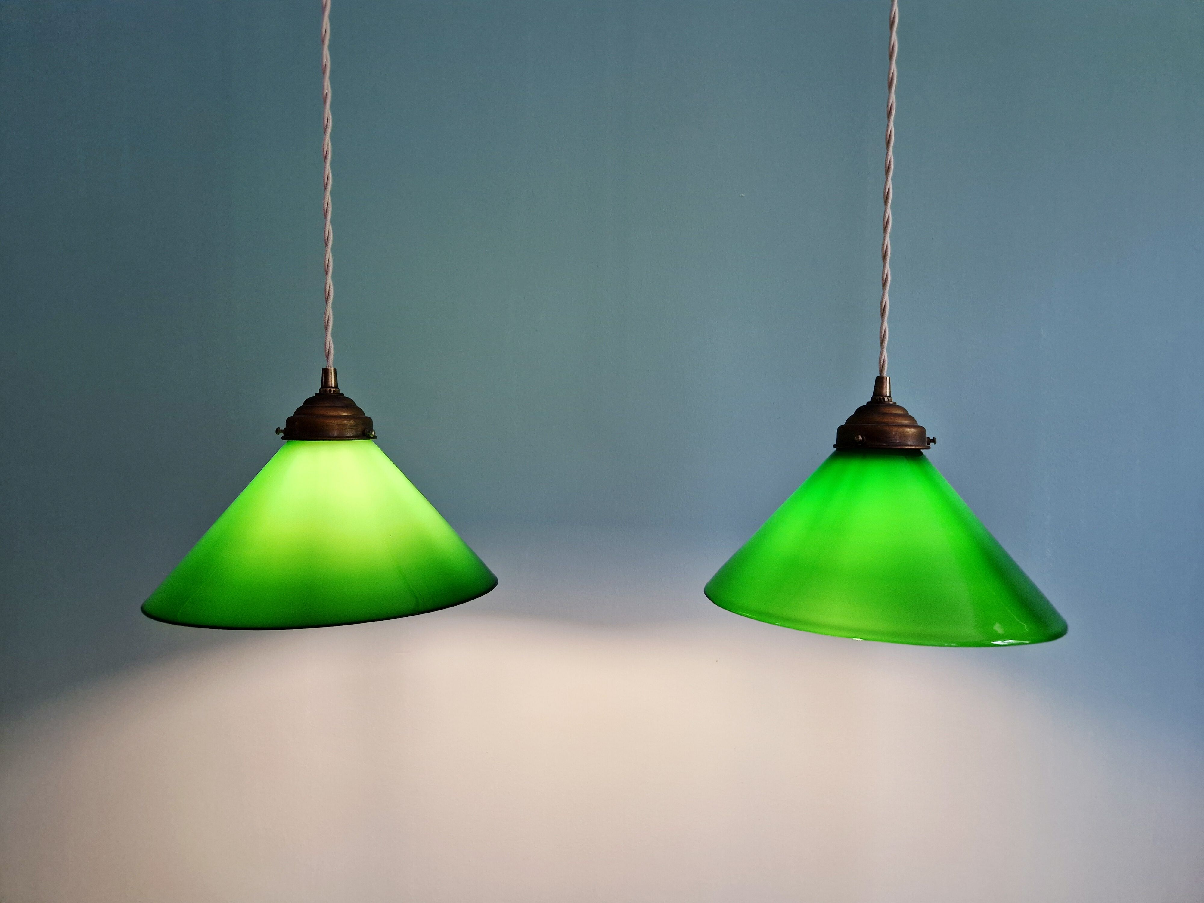 Pair of conical green opaline pendant lights, Art Deco style