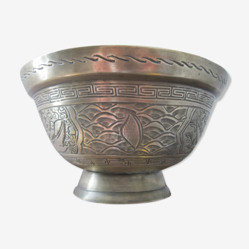 Ancient brass pot cover with offerings from Asia