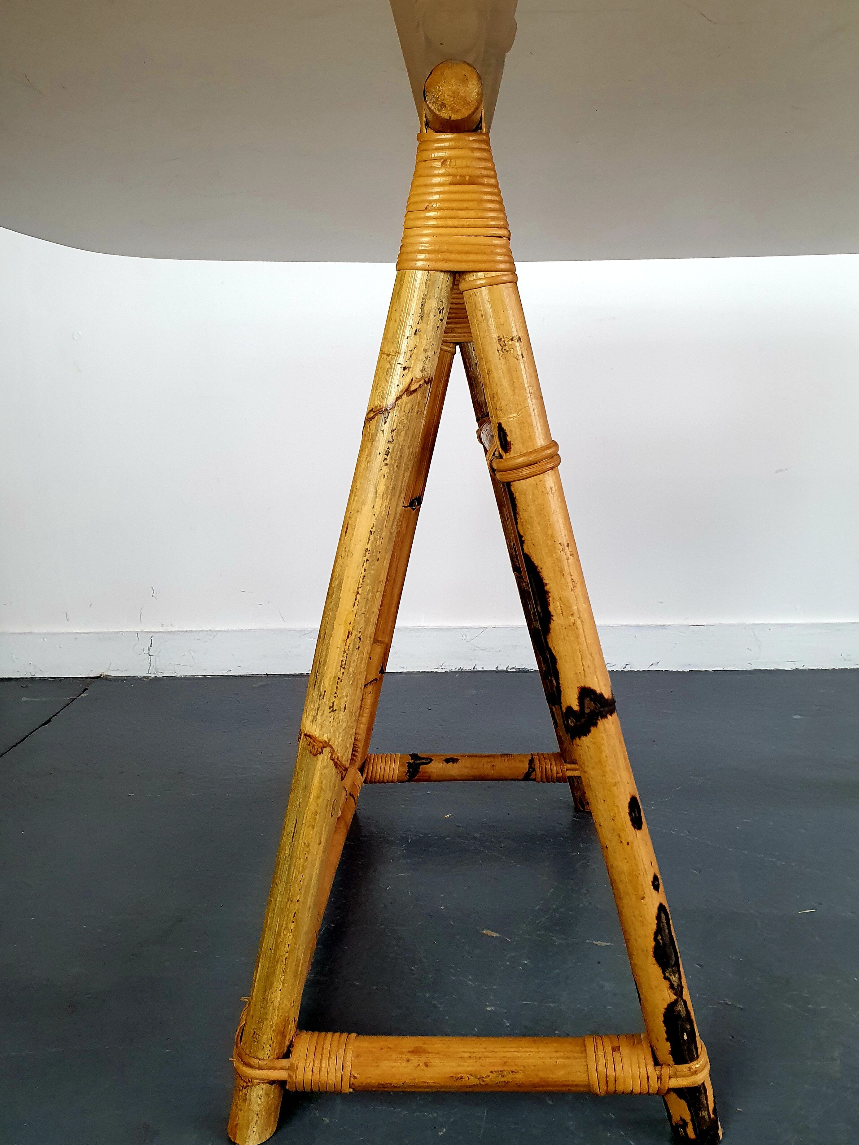 1970s dining table with bamboo trestle legs and smoked glass