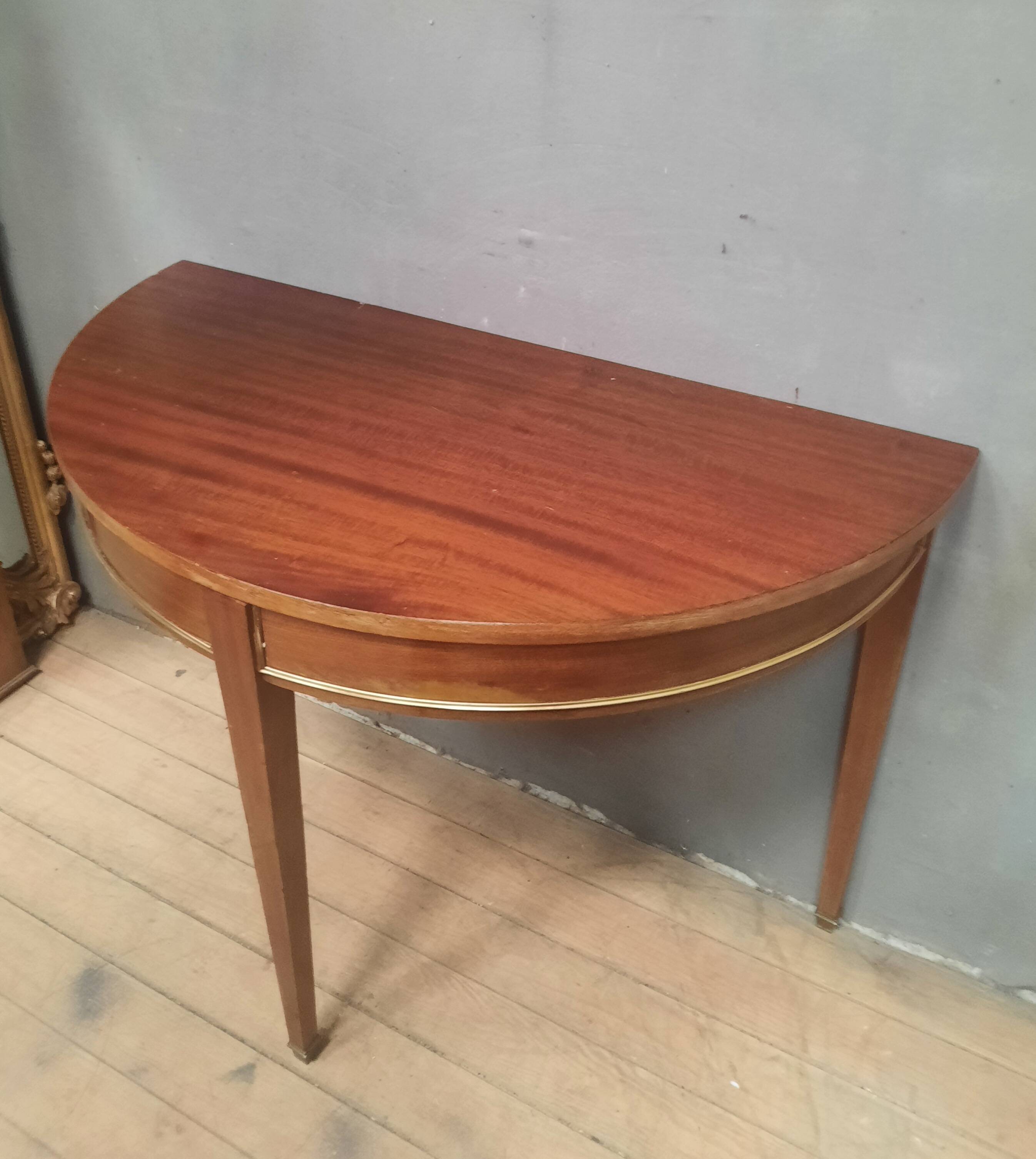 Louis XVI style console in mahogany.