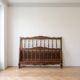 Double bed frame in antique Louis XV style made of solid wood.