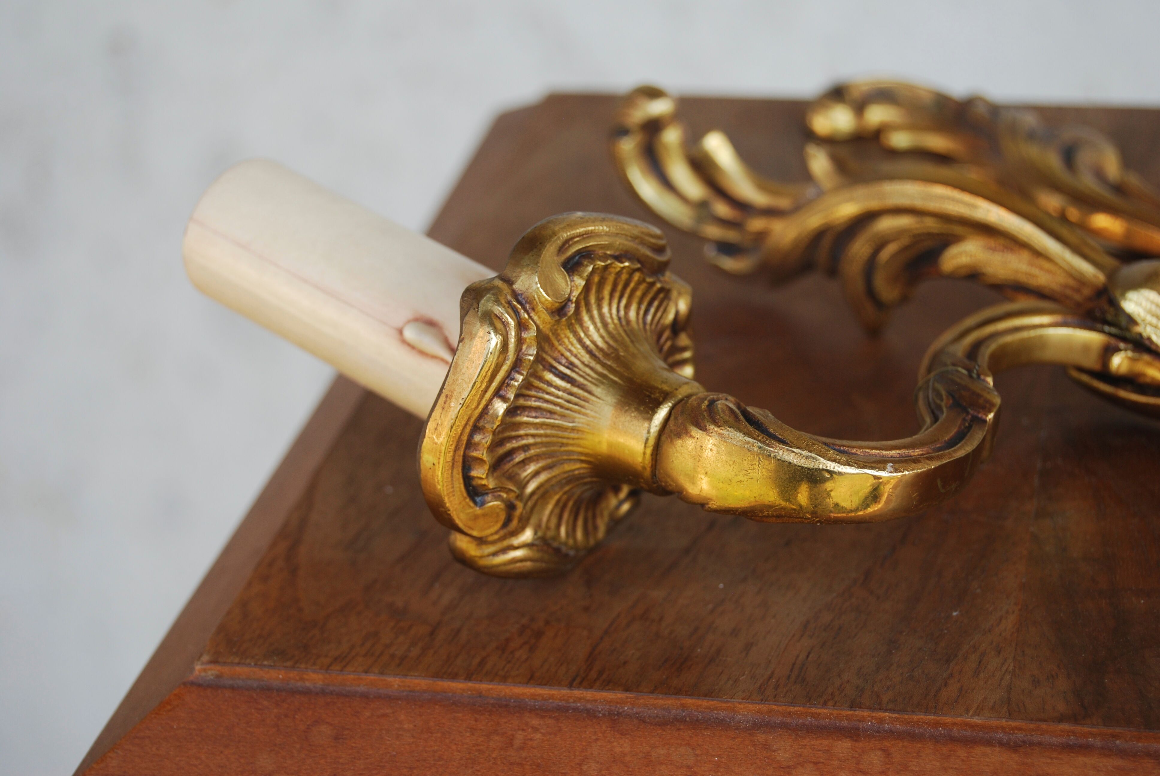 Pair of Louis XV style sconces in bronze with 1 arm of light