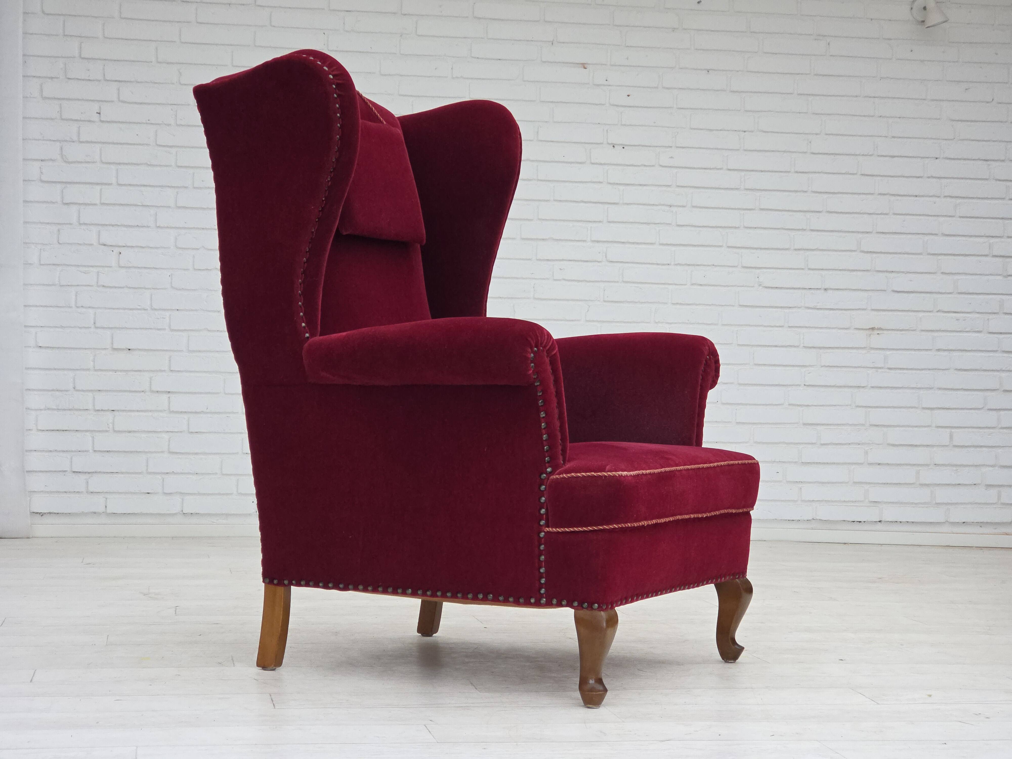 1960s, Danish highback wingback armchair, cherry-red furniture velour.