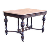 Table from the late 19th century, neo-Renaissance style, in black and oak.