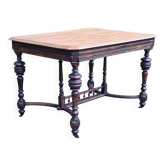 Table from the late 19th century, neo-Renaissance style, in black and oak.