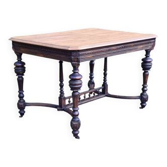 Table from the late 19th century, neo-Renaissance style, in black and oak.