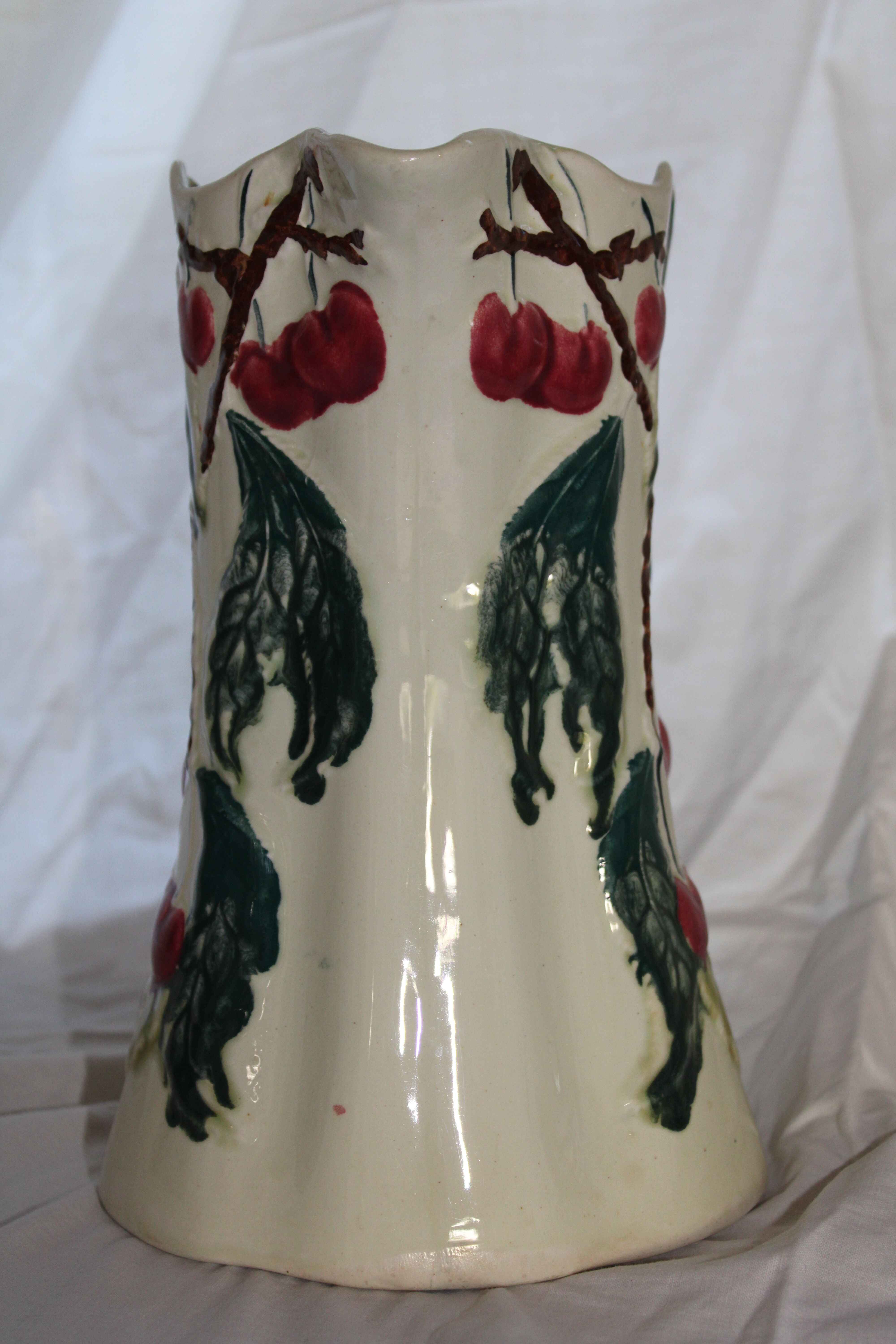 Ancient pitcher in earthenware decoration cherry Saint Amand waters