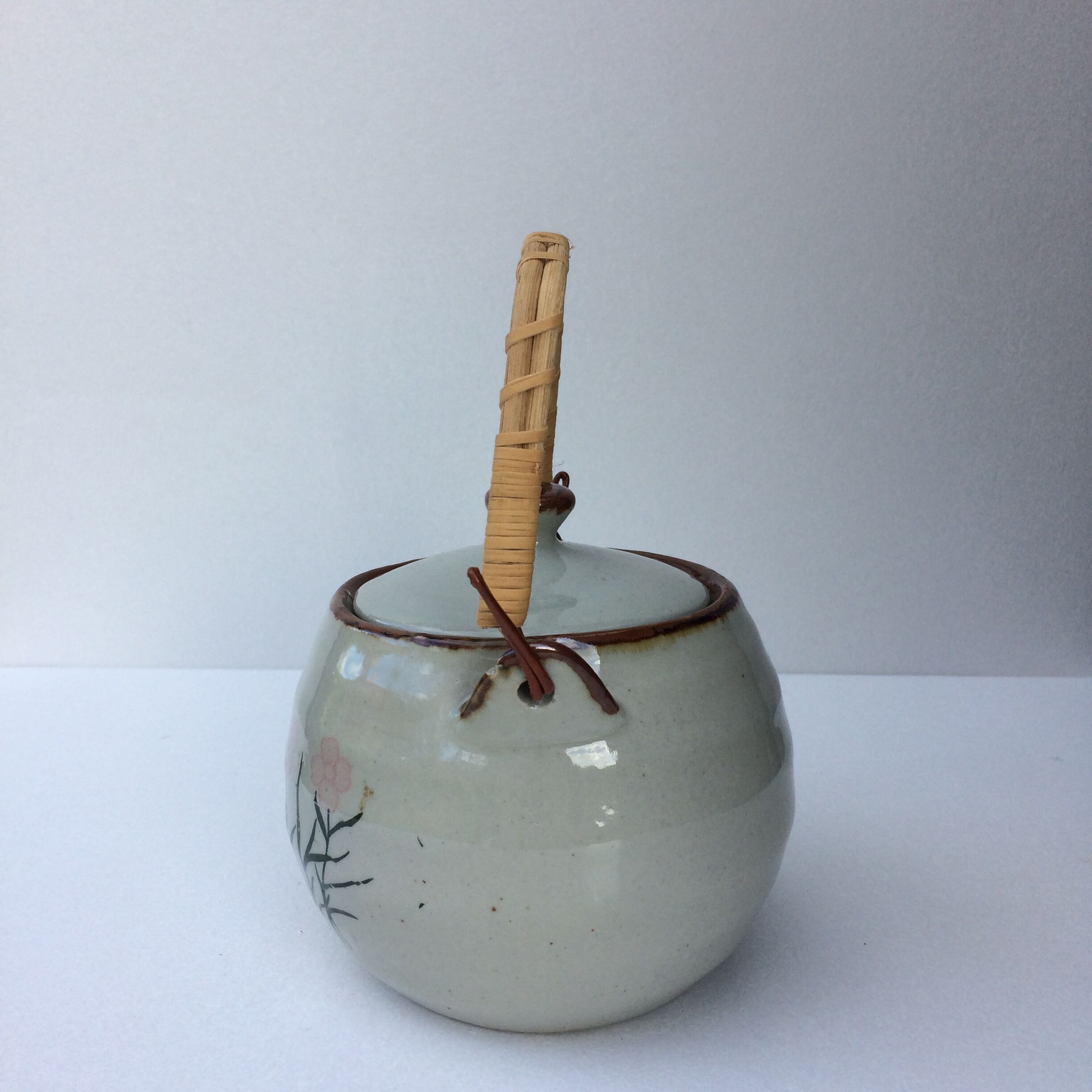 Vintage teapot wicker handle