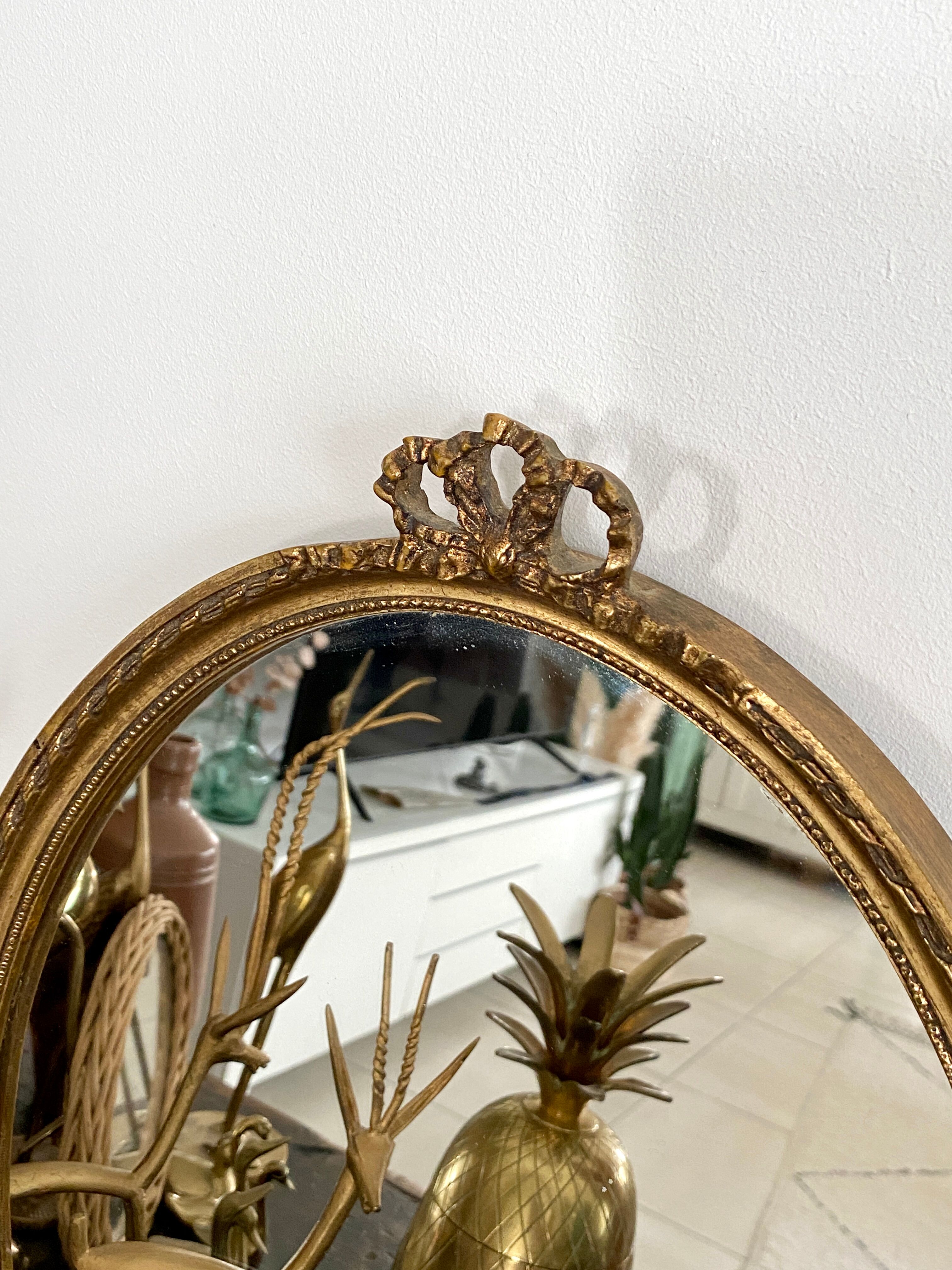 Golden oval mirror 32x44cm