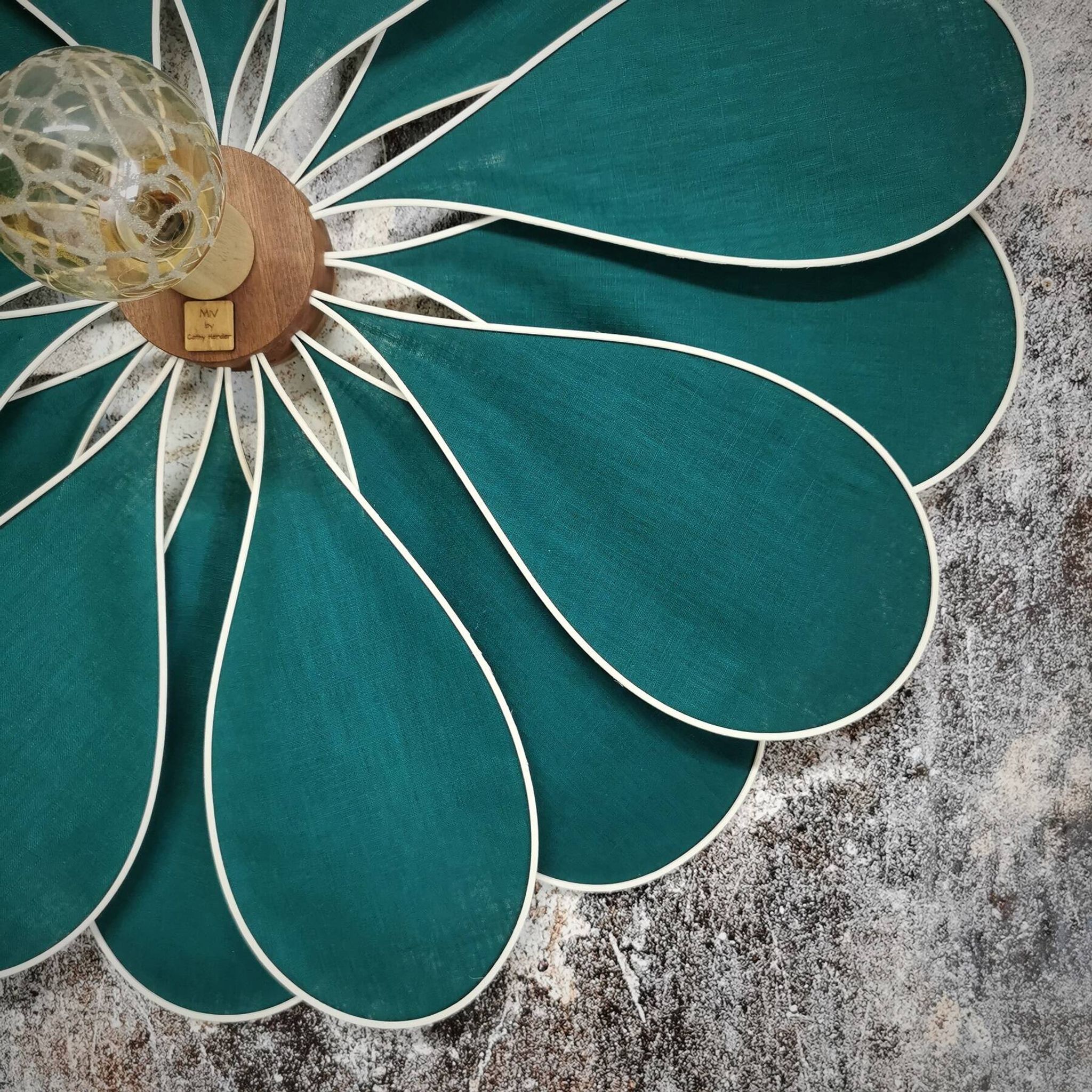 Emerald green rattan and linen flower wall light with 16 petals