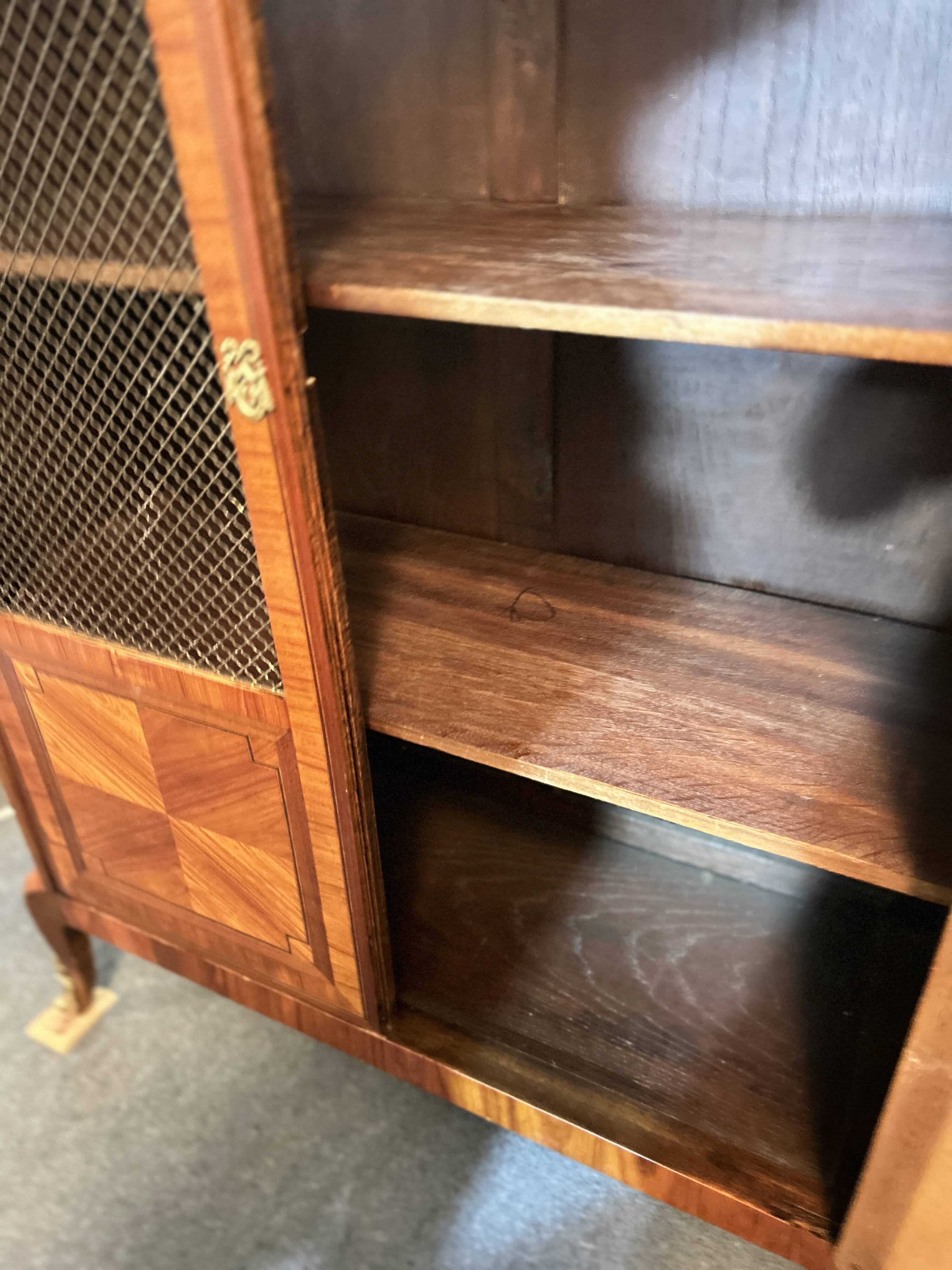 Directoire style display cabinet with two doors