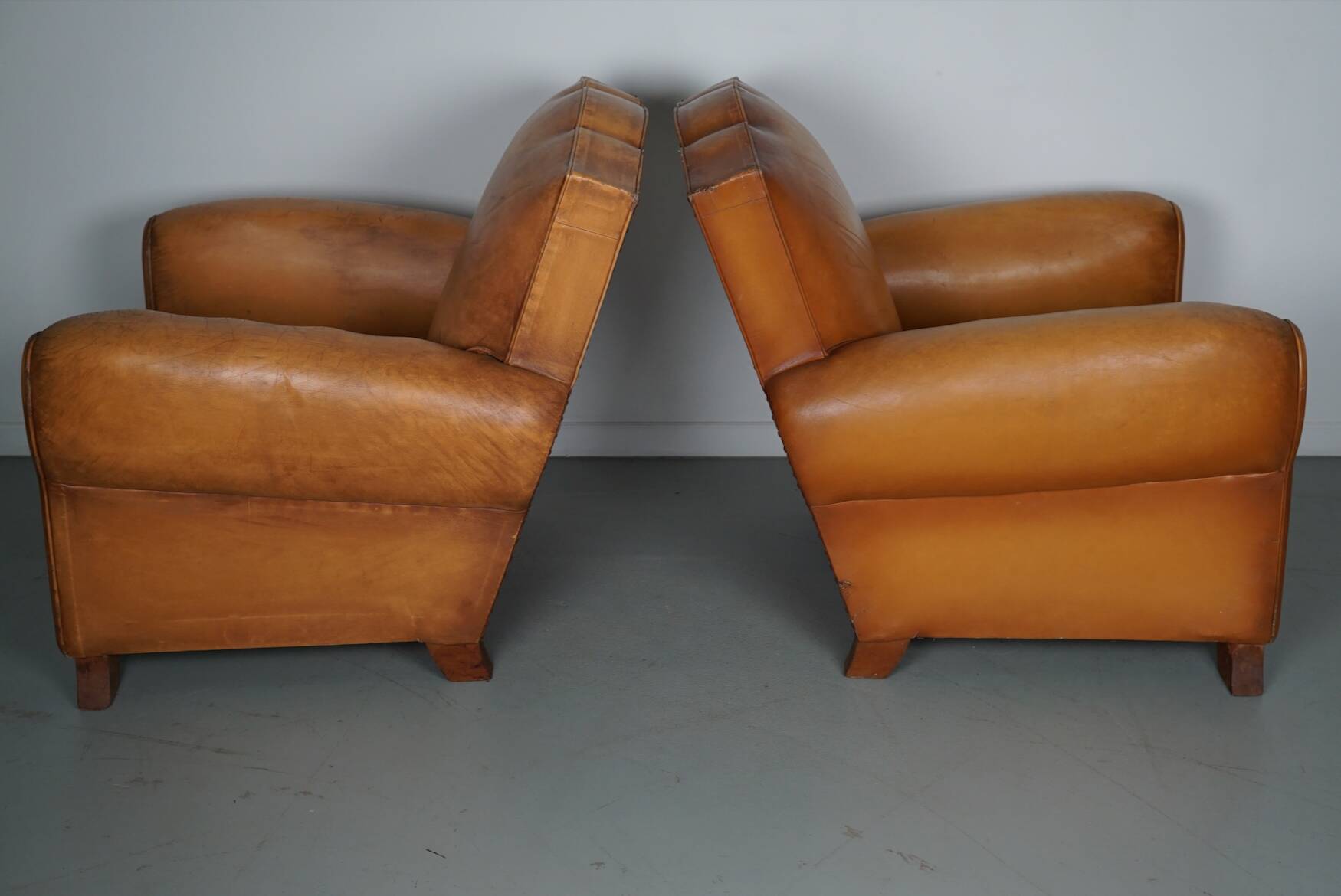 Pair of French Cognac Moustache Back Leather Club Chairs, 1950s