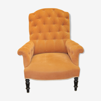 Fauteuil capitonné