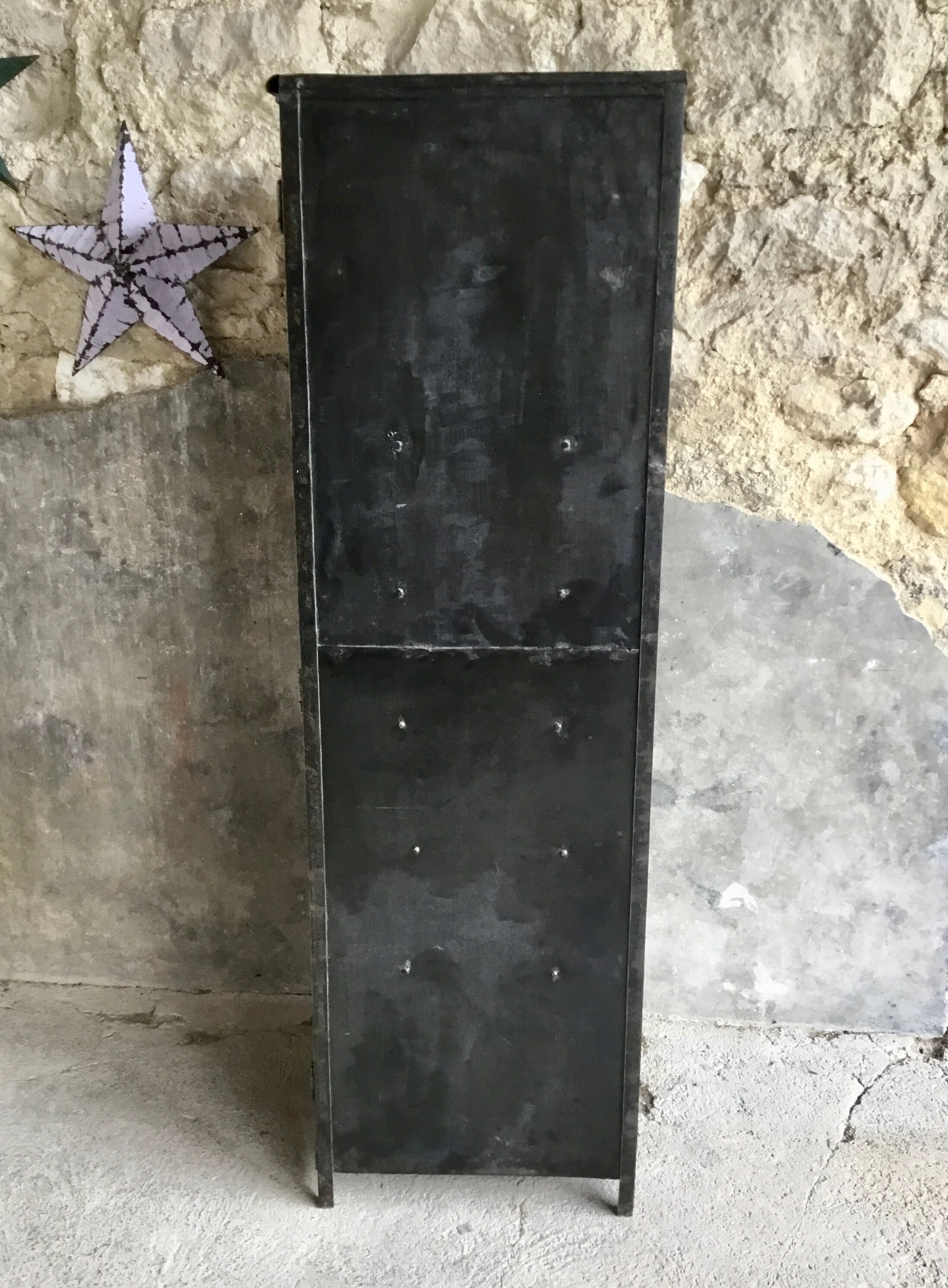 Riveted cloakroom converted into storage cabinet - early twentieth century