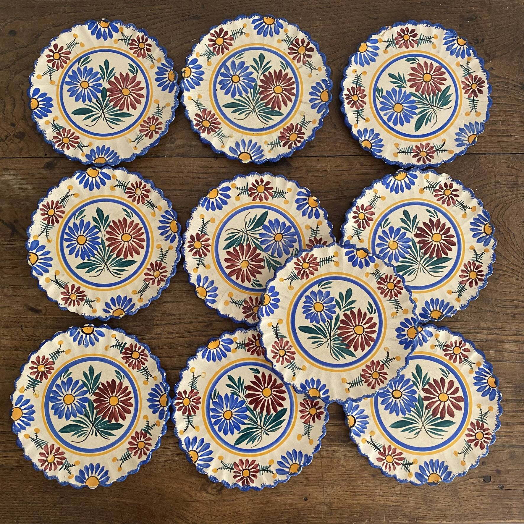 Henriot Quimper dessert plates, hand-painted earthenware.