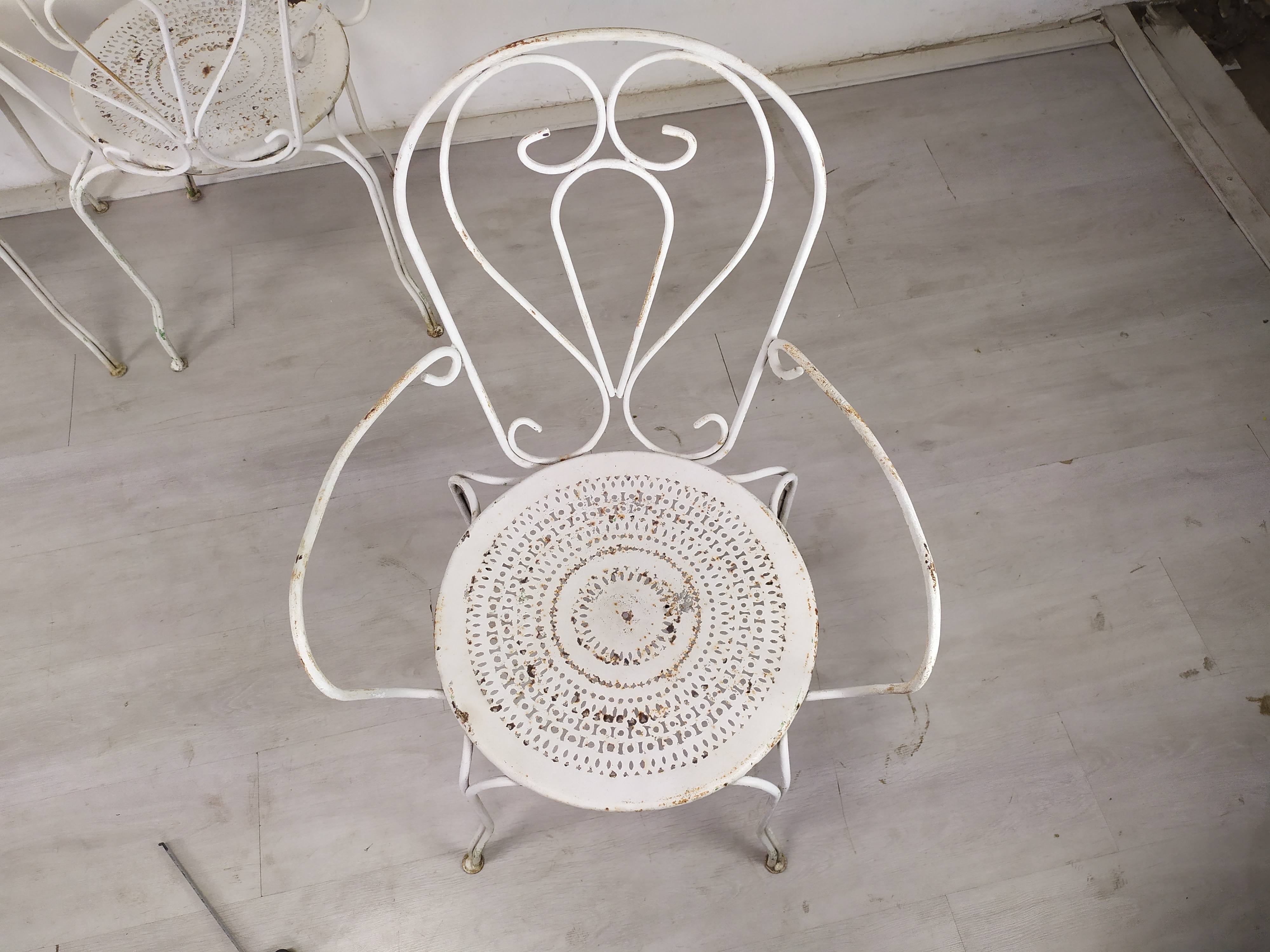 4 wrought iron garden armchairs