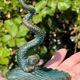 Antique candlestick base – stylised marine fish in patinated bronze