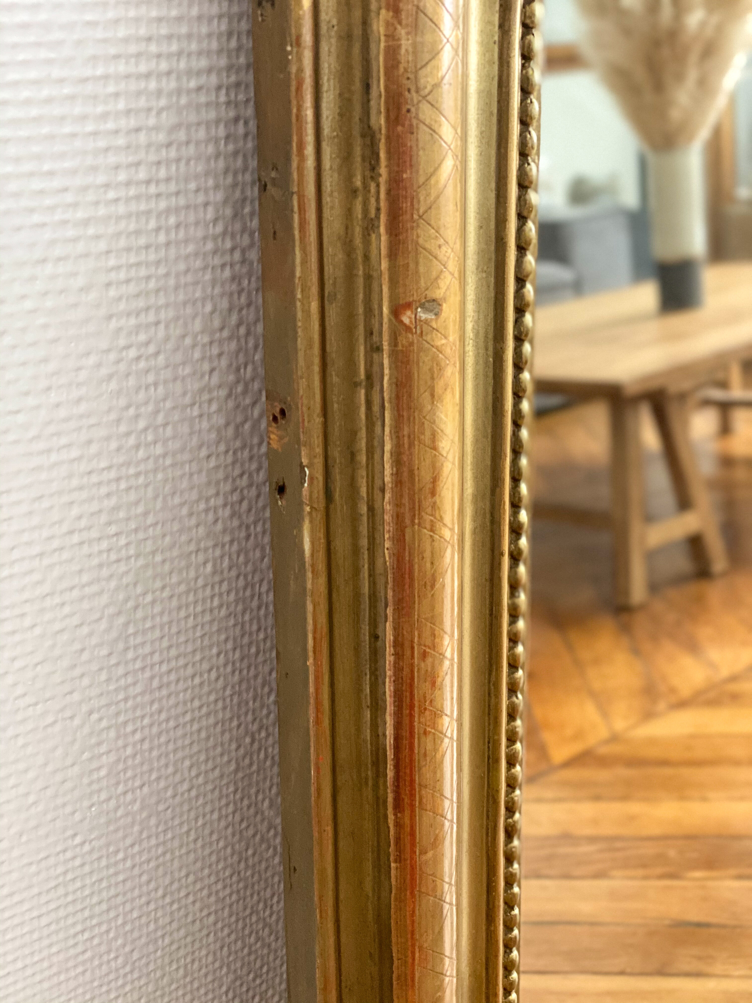 Miroir Louis Philippe perlé doré sculpté 74x98cm