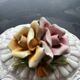 Capodimonte-style porcelain lidded sugar bowl with floral relief
