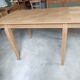 Oak dining table with a checkerboard top and extensions.