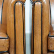 Set of 2 sheep leather club chairs finished with black piping