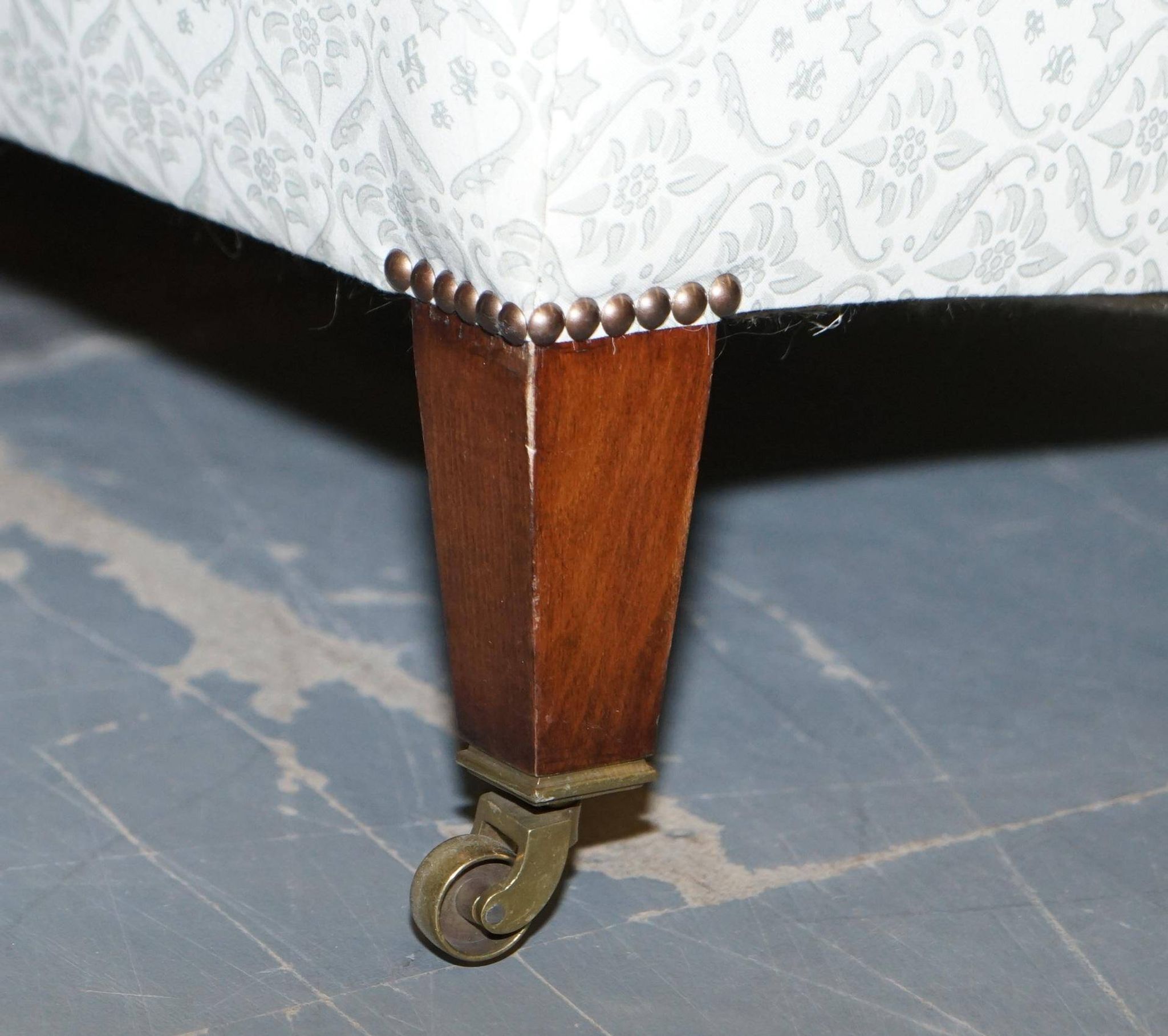 Howard & Sons canapé with feather cushions and ticking fabric, Victorian style.