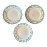 3 flat plates in ironstone with a floral green border.